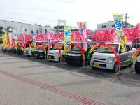 沖縄の中古車販売店ならくるまcafe にこにこピース