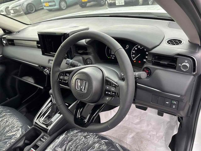 ヴェゼル ｅ：ＨＥＶ　Ｚ　登録済み未使用車　バックカメラ　クリアランスソナー　オートクルーズコントロール　レーンアシスト　衝突被害軽減システム　オートライト　ＬＥＤヘッドランプ　電動リアゲート　アルミホイール　スマートキー（54枚目）