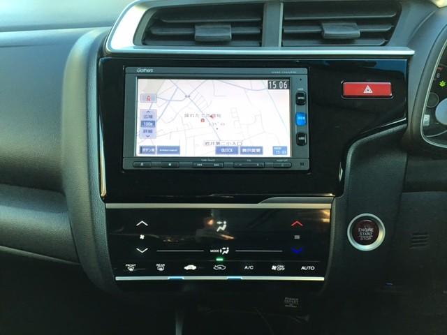 フィット 13G・Fパッケージ AUX対応 イモビ LEDライト DVD再生可能 スマ-トキ- 記録簿有り VSA ETC付き 地デジTV 助手席エアバッグ メモリーナビ Rカメラ オートエアコン エアバック PS キ-フリ- PW(12枚目)