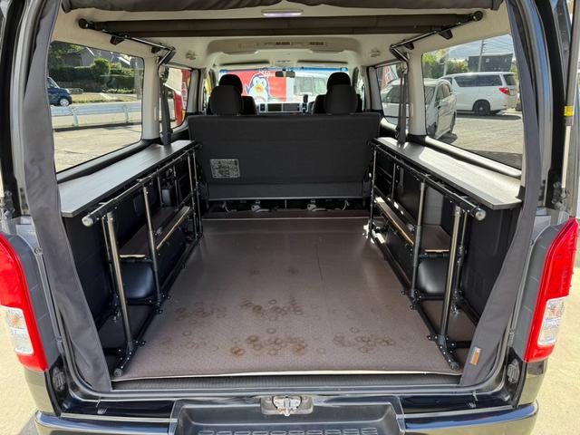 ハイエースバン ロングワイドスーパーＧＬ　４ＷＤ　ワンオーナー　両側パワースライドドア　スマートキー　ＬＥＤヘッドライト　リフトアップ　大径タイヤ新品付き　ダブルモニター　ナビ　後席モニター　社外スピーカー　フルセグテレビ　トランク２段棚付き（25枚目）