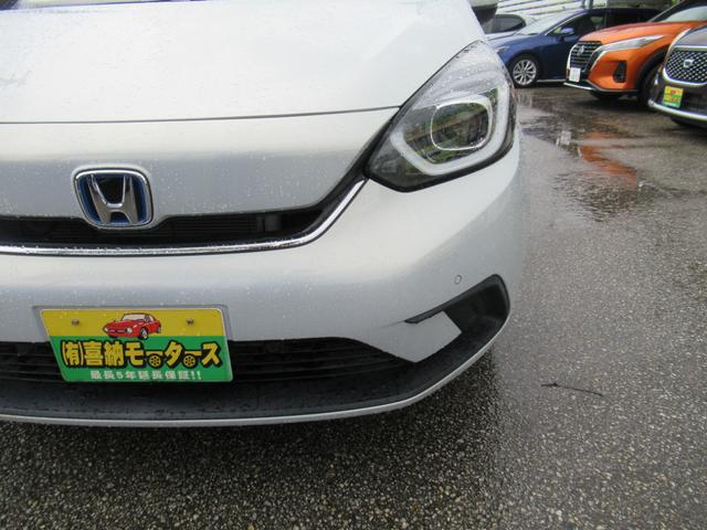 フィット e:HEVホーム 衝突被害軽減ブレーキ 白線逸脱警報 誤発進抑制 横滑り防止装置 パーキングセンサー 電動格納ドアミラー LEDヘッドライト ハーフレザーシート 地デジ ナビ DVD Bluetooth バックカメラ(12枚目)