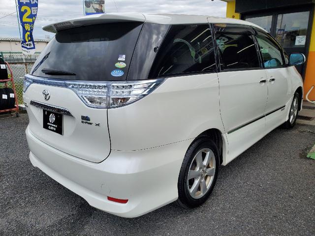 エスティマハイブリッド Ｘ　両側電動スライド　キーレス　フルセグ　ナビ＆ＴＶ　１７アルミホイール　乗車定員８人　エアバッグ　オートマ　フル装備　助手席エアバッグ　ＨＩＤヘッドライト　ＥＴＣ　バックカメラ　スマートキー（3枚目）