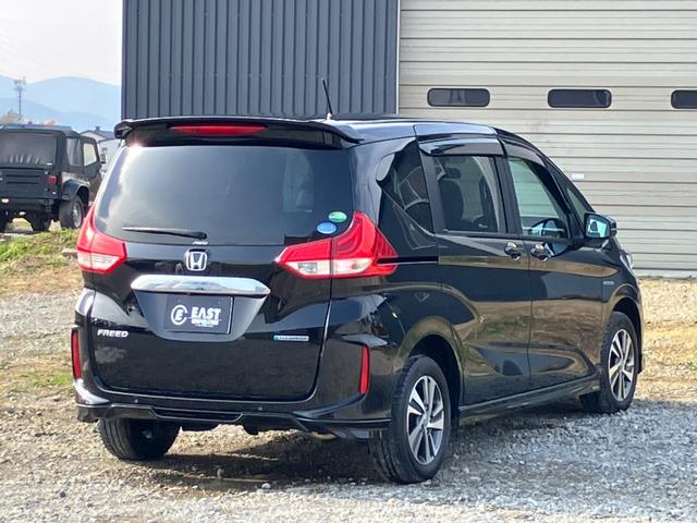 フリードハイブリッド ハイブリッド・Gホンダセンシング 4WD 本州仕入 後期型 ワンオーナー 寒冷地仕様 社外フルセグナビ バックカメラ 後席モニター シートヒーター ハーフレザーシート フルフラット 両側電動スライドドア LEDヘッドライト ETC(8枚目)