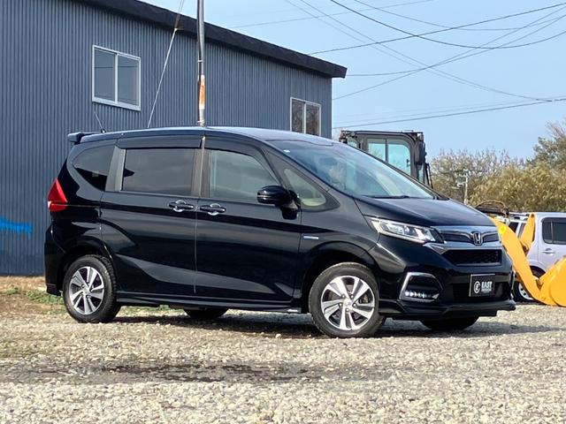 フリードハイブリッド ハイブリッド・Gホンダセンシング 4WD 本州仕入 後期型 ワンオーナー 寒冷地仕様 社外フルセグナビ バックカメラ 後席モニター シートヒーター ハーフレザーシート フルフラット 両側電動スライドドア LEDヘッドライト ETC(26枚目)