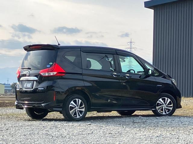 フリードハイブリッド ハイブリッド・Gホンダセンシング 4WD 本州仕入 後期型 ワンオーナー 寒冷地仕様 社外フルセグナビ バックカメラ 後席モニター シートヒーター ハーフレザーシート フルフラット 両側電動スライドドア LEDヘッドライト ETC(35枚目)