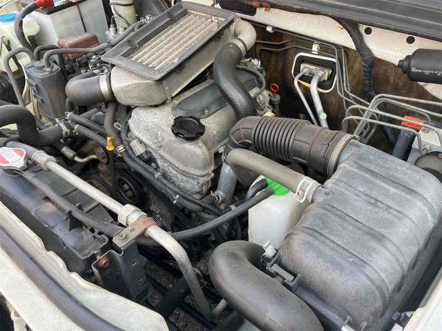 ジムニー ワイルドウインド　４ＷＤ　キーレスエントリー　ＡＴ　ＡＢＳ　ＣＤ　ＭＤ　カセット　アルミホイール　衝突安全ボディ　エアコン　パワーウィンドウ（30枚目）