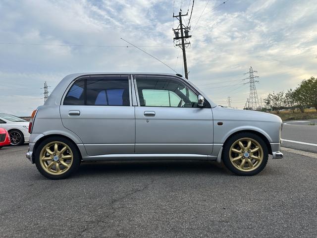 ミラジーノ ミニライトスペシャル　ナルディステアリング　Ｌ８８０Ｋコペン足回り　Ｌ８８０ＫコペンＦブレーキ　ナビ　キーレスエントリー　ＡＴ　アルミホイール　衝突安全ボディ　エアコン　パワーステアリング　パワーウィンドウ（13枚目）