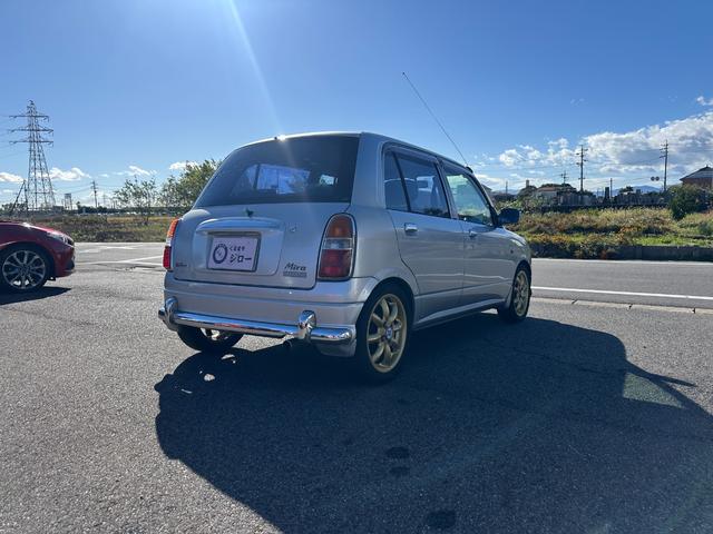 ミラジーノ ミニライトスペシャル　ナルディステアリング　Ｌ８８０Ｋコペン足回り　Ｌ８８０ＫコペンＦブレーキ　ナビ　キーレスエントリー　ＡＴ　アルミホイール　衝突安全ボディ　エアコン　パワーステアリング　パワーウィンドウ（14枚目）