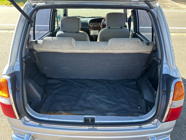 ミラジーノ ミニライトスペシャル　ナルディステアリング　Ｌ８８０Ｋコペン足回り　Ｌ８８０ＫコペンＦブレーキ　ナビ　キーレスエントリー　ＡＴ　アルミホイール　衝突安全ボディ　エアコン　パワーステアリング　パワーウィンドウ（17枚目）