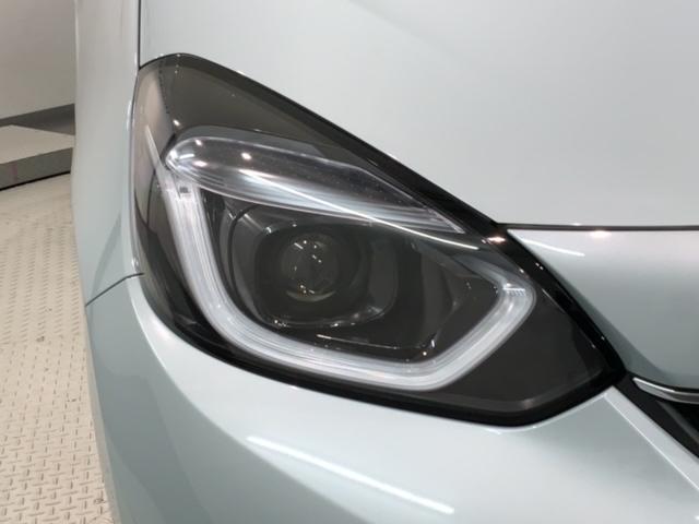 フィット e:HEVホーム HSENSING新車保証試乗車ワンオ-ナ- 前後誤発進抑制機能 助手席エアバッグ 運転席エアバッグ 1オナ 禁煙 LEDライト USB接続 バックカメラ ABS サイドエアバッグ フルセグTV 記録簿(8枚目)