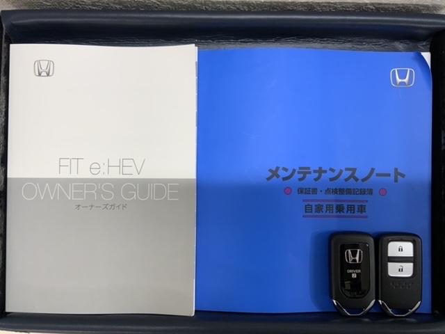 フィット e:HEVホーム HSENSING新車保証試乗車ワンオ-ナ- 前後誤発進抑制機能 助手席エアバッグ 運転席エアバッグ 1オナ 禁煙 LEDライト USB接続 バックカメラ ABS サイドエアバッグ フルセグTV 記録簿(16枚目)