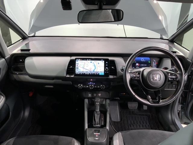 フィット ｅ：ＨＥＶＲＳ　ペット臭有り　Ｈ　ＳＥＮＳＩＮＧ　最長５年保証　純正ナビ　ＴＶ　Ｒカメラ　ＥＴＣ　ＬＥＤライト　ＶＳＡ　アルミ　スマ－トキ－　スペアキ－　盗難防止装置　整備記録簿　ドアバイザ－　ＡＡＣ　Ｗエアバッグ（9枚目）