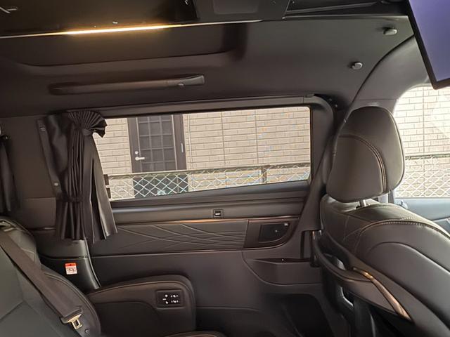 ヴェルファイアハイブリッド Z プレミア モデリスタエアロ&ガーニッシュ ユニバーサルステップ14インチリアシートエンターテイメントJBL15スピーカー 寒冷地 ITSコネクト ガラスコート エグゼクティブマット 遮光カーテン Rベッドキット(49枚目)