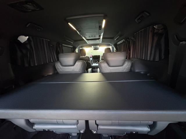 ヴェルファイアハイブリッド Z プレミア モデリスタエアロ&ガーニッシュ ユニバーサルステップ14インチリアシートエンターテイメントJBL15スピーカー 寒冷地 ITSコネクト ガラスコート エグゼクティブマット 遮光カーテン Rベッドキット(59枚目)