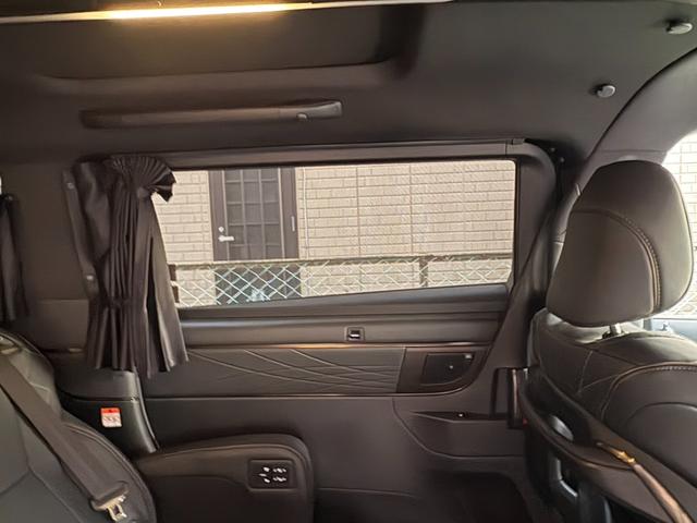 ヴェルファイアハイブリッド Z プレミア モデリスタエアロ&ガーニッシュ ユニバーサルステップ14インチリアシートエンターテイメントJBL15スピーカー 寒冷地 ITSコネクト ガラスコート エグゼクティブマット 遮光カーテン Rベッドキット(61枚目)