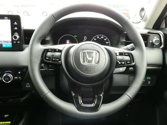 ヴェゼル ｅ：ＨＥＶ　Ｚ　登録済未使用車　９型ナビ　３６０°カメラ　ＥＴＣ２．０　後退出庫サポート　ＣＭＢＳ　ＡＣＣ　ＢＳＩ　アダプティブドライビングビーム　ＬＫＡＳ　ステアリングヒーター　ハンズフリーパワーバックドア（3枚目）