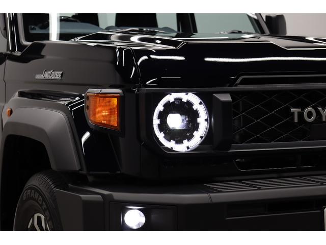 ランドクルーザー７０ ＡＸ　電動デフロック　丸目ＬＥＤヘッドライト　純正ナビ　バックカメラ内蔵防眩ミラー　ワンオーナー　木目調ステアリング　純正１６インチＡＷ　サイドバイザー　前後ドラレコ　トヨタセーフティーセンス搭載（11枚目）