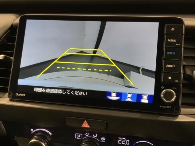 フィット e:HEVホーム H SENSING 新車保証 試乗車 ワンオ-ナ- ナビVXU-245FTi TV Rカメラ BTオ-ディオ ETC LEDライト VSA クルコン スマ-トキ- スペアキ- 盗難防止装置 整備記録簿(7枚目)