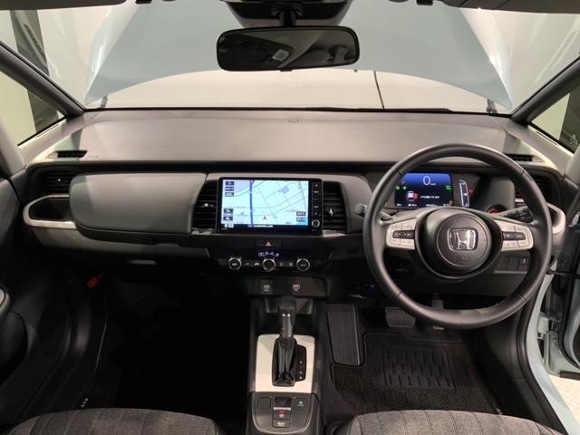 フィット e:HEVホーム H SENSING 新車保証 試乗車 ワンオ-ナ- ナビVXU-245FTi TV Rカメラ BTオ-ディオ ETC LEDライト VSA クルコン スマ-トキ- スペアキ- 盗難防止装置 整備記録簿(9枚目)