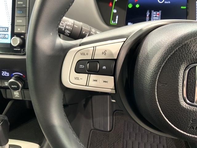 フィット e:HEVホーム H SENSING 新車保証 試乗車 ワンオ-ナ- ナビVXU-245FTi TV Rカメラ BTオ-ディオ ETC LEDライト VSA クルコン スマ-トキ- スペアキ- 盗難防止装置 整備記録簿(11枚目)