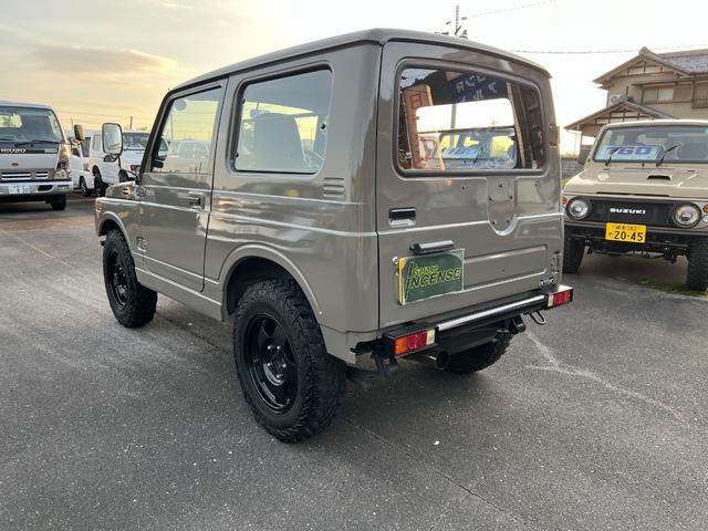 ジムニー ワイルドウインドリミテッド　ＪＡ１１－３型アッシュカーキ全塗装　圧縮圧力測定済　ＴベルトＷポンプ交換　前後ブラックバンパーナンバー移動　皮調シートカバー　ＡＷ塗装　ジオランダー　天井加工済（4枚目）