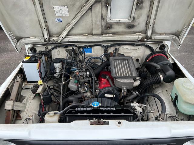 ジムニー EC JA11-2型 圧縮圧力測定済パノラマハイルーフ2インチボディーリフト検対応 前後ステンバンパー ナンバー移動 検対応マフラー MTタイヤ社外アルミ キングピンOH済クラッチOH付TベルトWポンプ交換(18枚目)