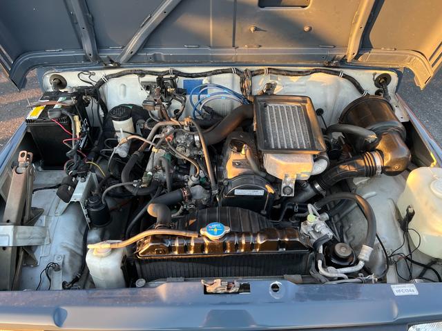 ジムニー ランドベンチャー　ＪＡ１１－５型最終ブルーツートン全塗装　　圧縮圧力測定済　ＴベルトＷポンプ交換済　フロントタニグチＢＰ　ホイル塗装　ジオランダーＡＴ　ナルディーウッドＣＤ　ＥＴＣ　皮調シートカバー（22枚目）