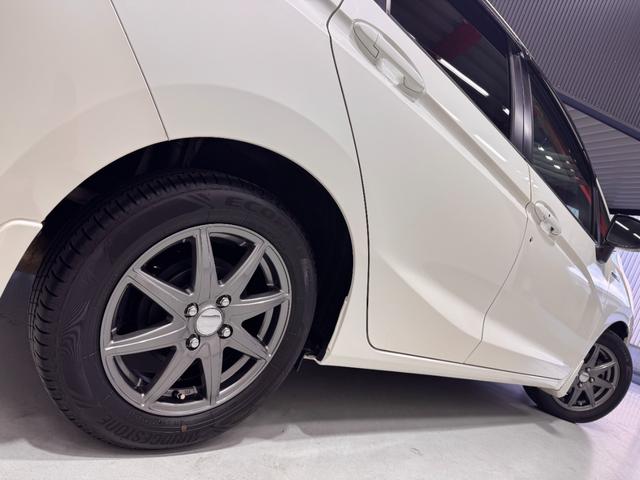 フィットハイブリッド Ｌパッケージ　純正ナビ　ＥＴＣ　バックカメラ　クルーズコントロール　ハーフレザーシート　Ｂｌｕｅｔｏｏｔｈ　テレビ　ＤＶＤ　ＣＤ　社外１５インチＡＷ　ＬＥＤヘッドライト　プッシュスタート　スマートキー（33枚目）
