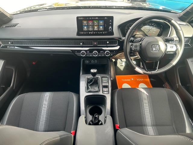 シビック ＬＸ　６速マニュアル　ホンダセンシング　純正ナビ　フルセグＴＶ　バックカメラ　ＥＴＣ２．０　プッシュスタート　スマートキー　運転席＆助手席シートヒーター　純正アルミ（9枚目）