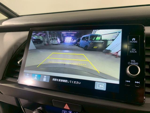 フィット ｅ：ＨＥＶＲＳ　当社デモカー　ドラレコ　フルセグＴＶ　ＡＷ　エアバッグ　ナビ＆ＴＶ　パワーウィンドウ　助手席エアバッグ　Ｄレコ　フルセグテレビ　ＬＥＤヘッドランプ　フルオートエアコン　ＥＴＣ装備　禁煙　スマートキ（12枚目）