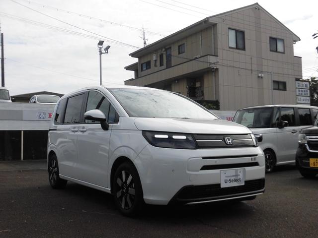 フリード エアーEX 元試乗車 純正ナビ ホンダセンシング LEDヘッドライトETC バックモニター リアクーラー 盗難防止システム 両側パワースライドドア 横滑り防止装置 クルコン フルセグ ETC車載器 オートエアコン(3枚目)