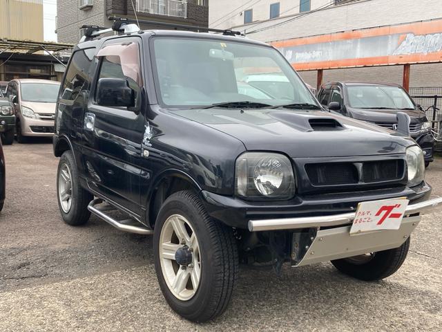 ジムニー ワイルドウインド　５ＭＴ　パートタイム４ＷＤ　高低二段切替式　背面タイヤ　キーレスエントリー　インタークーラーターボ　Ｗエアバッグ　走行５．７万Ｋ　ヘッドライトレベライザー（3枚目）