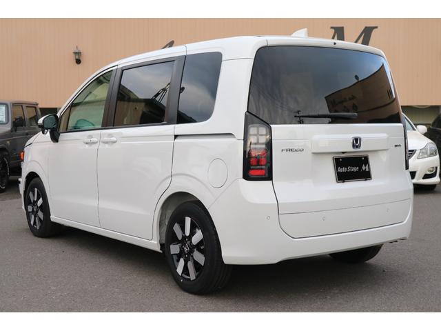 フリード ｅ：ＨＥＶエアー　ＥＸ　ＤＡＭＤ　ＩＳＯＬＡＴＯＲ　ダムドアイソレーター　フェイスチェンジキット　登録済み未使用車　７人乗り　パールホワイト　両側パワースライドドア（7枚目）