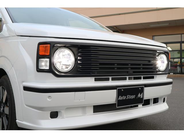 フリード ｅ：ＨＥＶエアー　ＥＸ　ＤＡＭＤ　ＩＳＯＬＡＴＯＲ　ダムドアイソレーター　フェイスチェンジキット　登録済み未使用車　７人乗り　パールホワイト　両側パワースライドドア（9枚目）