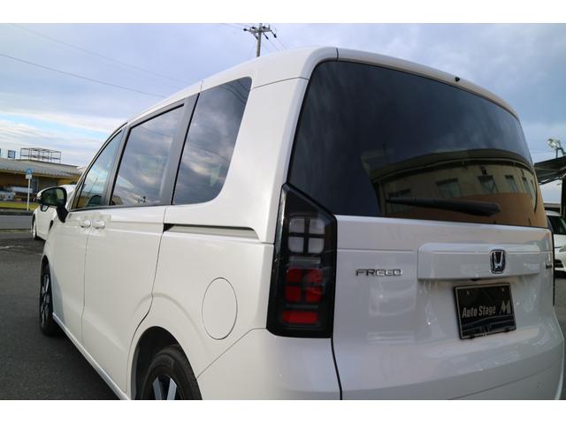 フリード ｅ：ＨＥＶエアー　ＥＸ　ＤＡＭＤ　ＩＳＯＬＡＴＯＲ　ダムドアイソレーター　フェイスチェンジキット　登録済み未使用車　７人乗り　パールホワイト　両側パワースライドドア（50枚目）