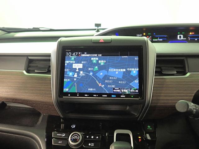 フリードハイブリッド ハイブリッド・クロスターホンダセンシング　ギャザズ９インチメモリーナビ　フルセグＴＶ　ＣＤ＆ＤＶＤ再生　ブルートゥース　バックカメラ　ＥＴＣ車載器　両側電動スライドドア　シートヒーター　ＬＥＤオートライト　ワンオーナー　ドラレコ前後（7枚目）