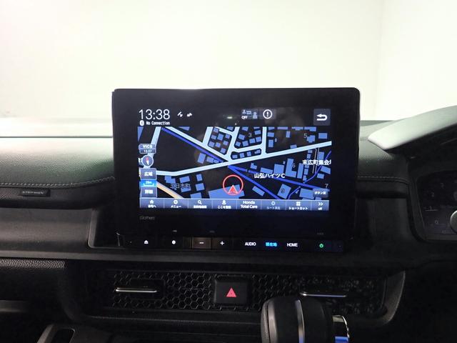 ステップワゴン スパーダ　ギャザズ９インチナビ　フルセグＴＶ　ＣＤ＆ＤＶＤ再生　ブルートゥース　天吊りモニター　Ｂカメラ　ＥＴＣ車載器　Ｐセンサー　両側電動スライドドア　Ｓヒーター　ＬＥＤオートライト　ワンオーナー　禁煙車（8枚目）