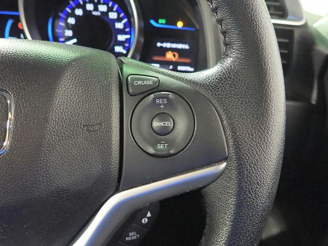 フィットハイブリッド Lパッケージ ギャザズSDナビ フルセグTV CD&DVD再生 ブルートゥース バックカメラ ETC車載器 LEDオートライト ワンオーナー あんしんパッケージ ハーフレザーシート アイドリングストップ(14枚目)