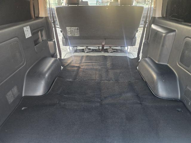 ハイエースバン ロングスーパーＧＬマルチロールトランスポータタイプＩ　ダークプライム　ディーゼルターボ　モデリスタエアロ　ＬＥＤオプションヘッドライト　リアスポイラー　パールホワイト　ハーフレザーシート　両側スライドドア　テレビ　バックカメラ　プッシュスタート　ＥＴＣ（14枚目）