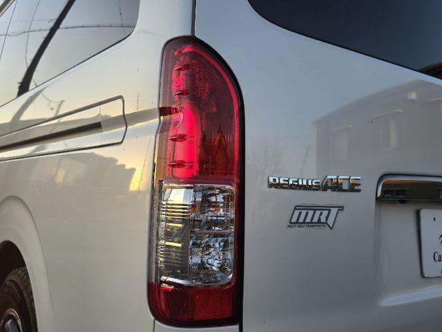 ハイエースバン ロングスーパーＧＬマルチロールトランスポータタイプＩ　ダークプライム　ディーゼルターボ　モデリスタエアロ　ＬＥＤオプションヘッドライト　リアスポイラー　パールホワイト　ハーフレザーシート　両側スライドドア　テレビ　バックカメラ　プッシュスタート　ＥＴＣ（44枚目）