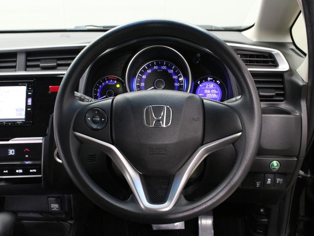 フィット １３Ｇ・Ｆパッケージ　ワンオーナー　禁煙車　純正メモリーナビ　リアカメラ　Ｂｌｕｅｔｏｏｔｈ　ハンドルリモコン　オートエアコン　スマートキー　ＤＶＤ　地デジ　社外アルミ（22枚目）