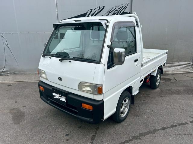サンバートラック  エアコン 社外アルミホイール12インチ 4WD 平床ボディ 三方開 社外オーディオ CD メーカーオプションフロントメッキバイザー メッキドアミラー 5MT 下廻りシャーシブラック塗装済み(7枚目)