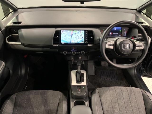 フィット e:HEVホーム H SENSING 新車保証 試乗車 ワンオーナー ナビVXU-245FTi TV Rカメラ CD録音 BTオ-ディオDVD ETC LEDライト VSA クルコン スマ-トキ- 盗難防止装置 AAC(9枚目)