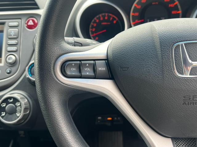 フィット Ｇスマートスタイルエディション　純正ナビ／スマートキー／リアカメラ／禁煙車／ドアバイザー／マニュアルエアコン／純正ＳＷ／ＨＩＤ／オートライト機能／保証なし／ＥＴＣ／（18枚目）