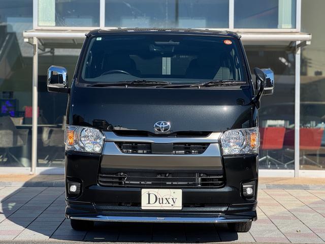 ハイエースバン ロングスーパーＧＬ　ダークプライムＳ　モデリスタエアロ（Ｆ／Ｓ／Ｒ）　社外１５インチＡＷ　パノラミックビューモニター　デジタルインナーミラー　寒冷地仕様　スカッフプレート　両側パワースライドドア　黒ハーフレザーシート　ＬＥＤヘッドライト（12枚目）