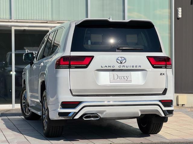 ランドクルーザー ZX モデリスタエアロ(F/R/オーバーフェンダー) JBLプレミアムサウンド リアエンターテイメント リア電動デフロック クールBOX タイヤ空気圧警報システム ベージュレザーシート(7枚目)