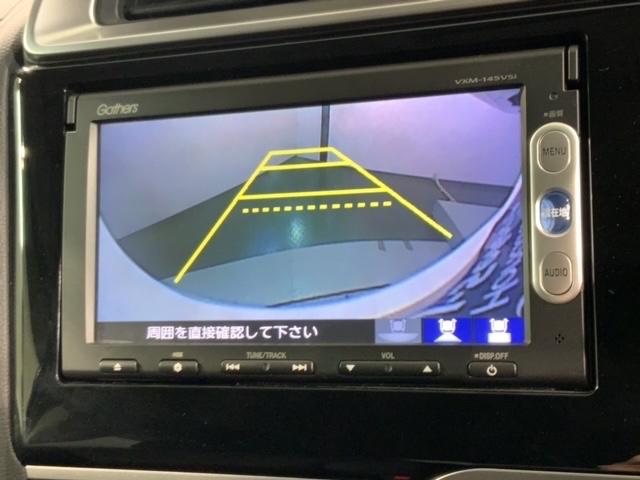 フィットハイブリッド Ｆパッケージ　１年保証　ナビＶＸＭ－１４５ＶＳｉ　ＴＶ　Ｒカメラ　ＤＶＤ　ドラレコ　ＥＴＣ　スマ－トキ－　盗難防止装置　ドアバイザ－　ＡＡＣ　Ｗエアバッグ　盗難警報装置　ＡＵＴＯエアコン　Ｄレコ　助手席エアバック（5枚目）