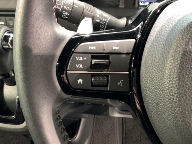 Ｎ－ＢＯＸカスタム ターボ　Ｈ　ＳＥＮＳＩＮＧ　新車保証　試乗車　ワンオ－ナ－　ナビＬＸＵ－２４２ＮＢｉ　ＴＶ　Ｒカメラ　ＣＤ録音　ＢＴオ－ディオ　ＤＶＤ　シ－トヒ－タ－　ＥＴＣ　ＬＥＤライト　両側電動ドア　横滑り防止　クルコン（10枚目）