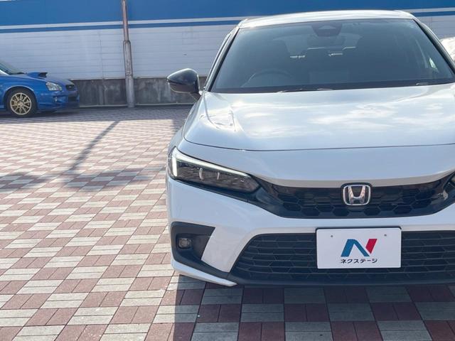 シビック ｅ：ＨＥＶ　禁煙車　９型ホンダコネクトナビ　ＢＯＳＥサウンド　バックカメラ　ホンダセンシング　ＥＴＣ　ハーフレザー　ＬＥＤヘッド　純正１８インチアルミ　シートヒーター　パワーシート　スマートキー　レーダークルーズ（21枚目）