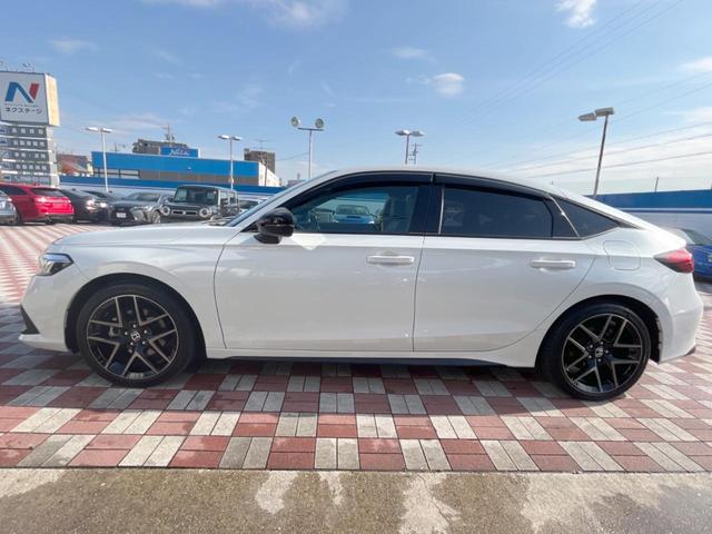 シビック ｅ：ＨＥＶ　禁煙車　９型ホンダコネクトナビ　ＢＯＳＥサウンド　バックカメラ　ホンダセンシング　ＥＴＣ　ハーフレザー　ＬＥＤヘッド　純正１８インチアルミ　シートヒーター　パワーシート　スマートキー　レーダークルーズ（26枚目）